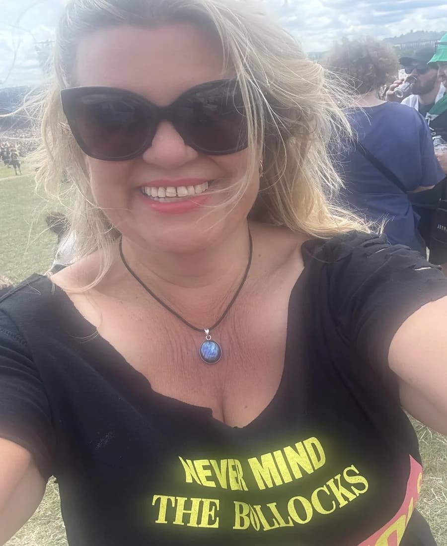 Lisa Hudson smiling at a live music event.